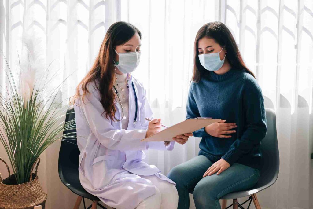 Fibroid surgery consultation showing doctor discussing uterine fibroid treatment and women’s reproductive health care